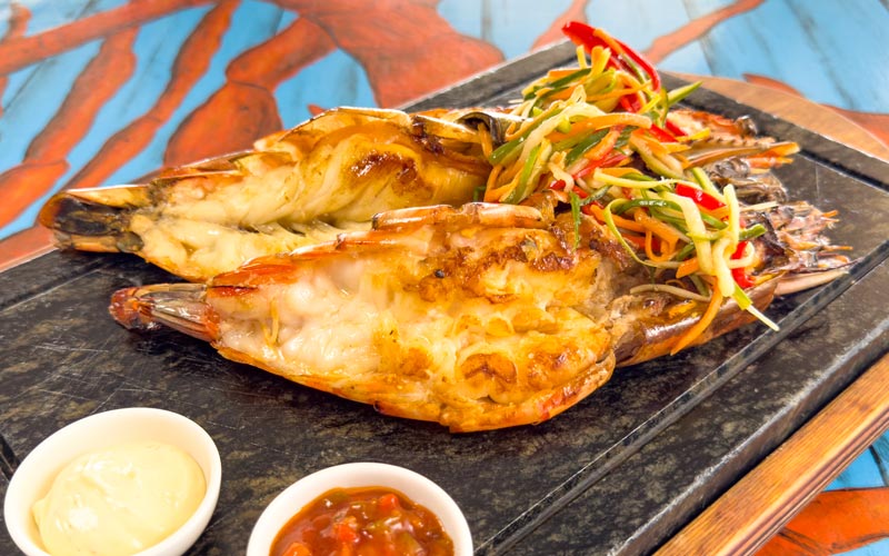 PalmBeach Tropical Restaurant | Grilled Tiger Prawns | served with vegetable julienne (carrots, red peppers, leeks, cucumbers) and extra virgin olive oil