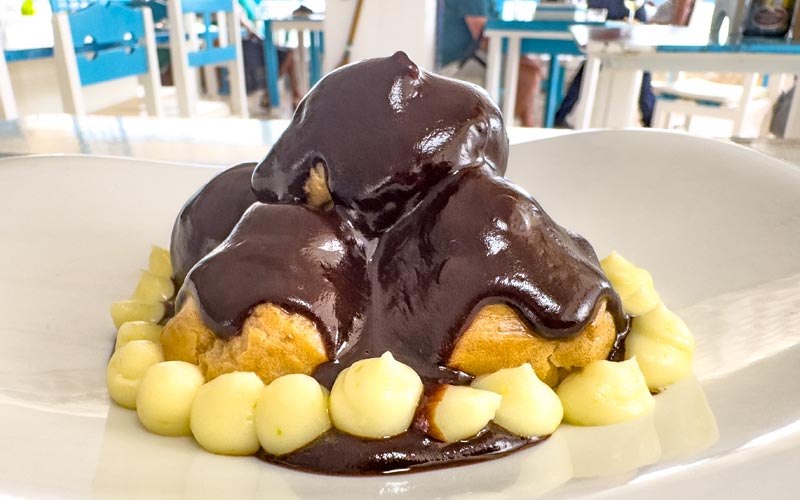 PalmBeach Tropical Restaurant | Profiteroles | chocolate-dipped cream puffs filled with whipped cream