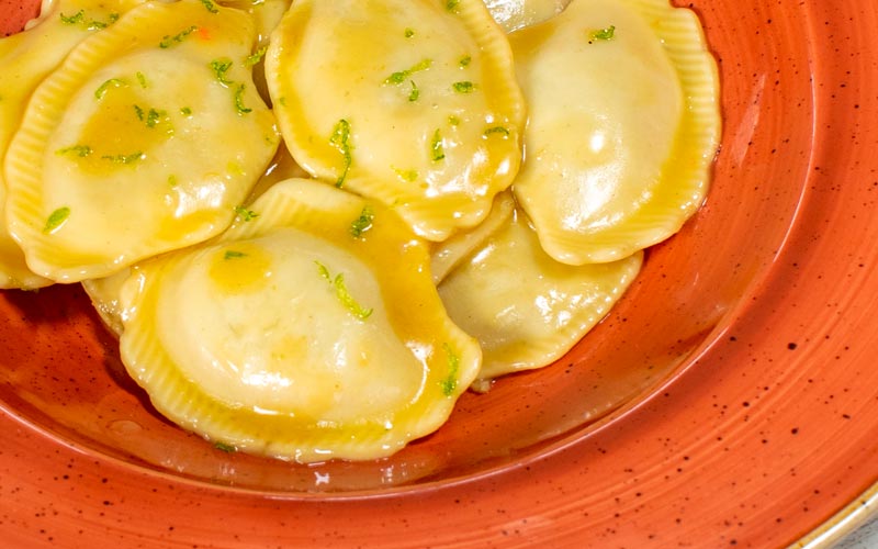 PalmBeach Tropical Restaurant | Delicate Ravioli with Spiny Lobster and Citrus Fruits | fresh artisan pasta filled with spiny lobster pulp, topped with citrus-flavoured butter