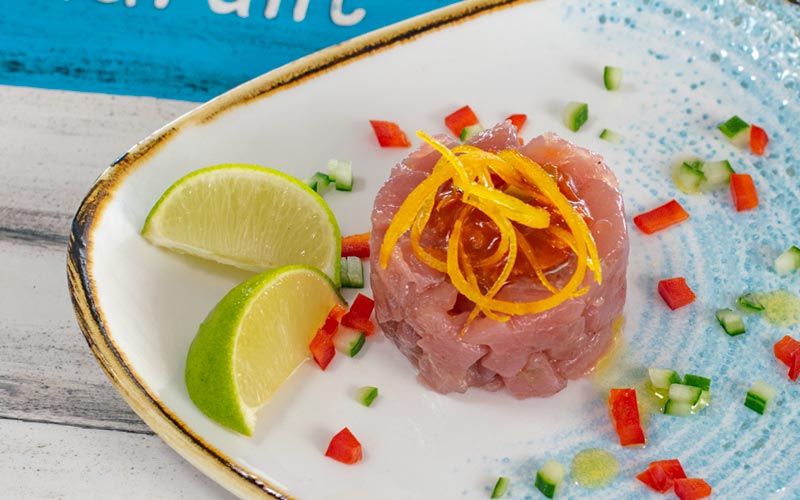 PalmBeach Tropical Restaurant | Tuna Tartare with Lime | cubes of tuna served with orange peel, lime black pepper, smoked salt e extra virgin olive oil