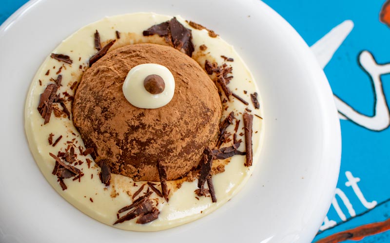 PalmBeach Tropical Restaurant | Chef’s Tiramisu | hemispherical Savoiardi soaked in coffee, layered with Zabaglione and Mascarpone cream, and dusted with cocoa powder