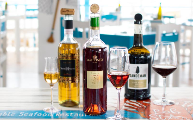 PalmBeach Tropical Restaurant | Zibibbo IGP Terre Siciliane Martinez <small>(by the glass)</small> | Vol. 16,0% / Moscato d’Alessandria / IGP Terre Siciliane / Italia, Sicilia / A superb dessert wine, crafted from concentrated musts. Its intense, aromatic profile invites imaginative pairings.