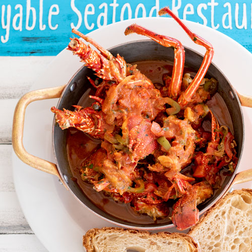 LobStar Enjoyable Seafood Restaurant | Sweaty Spiny Lobster | typical cape verdean spiny lobster, with peppers, onions, carrots, white wine and tomato sauce, all stewed in our delicious fish broth